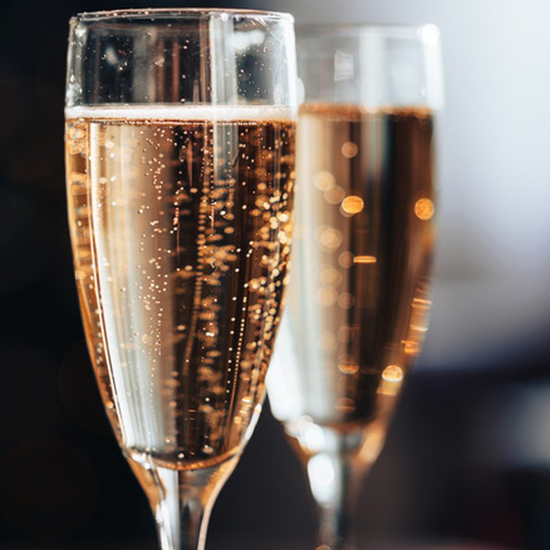 Champagne toast with flutes after a Married In Moments ceremony